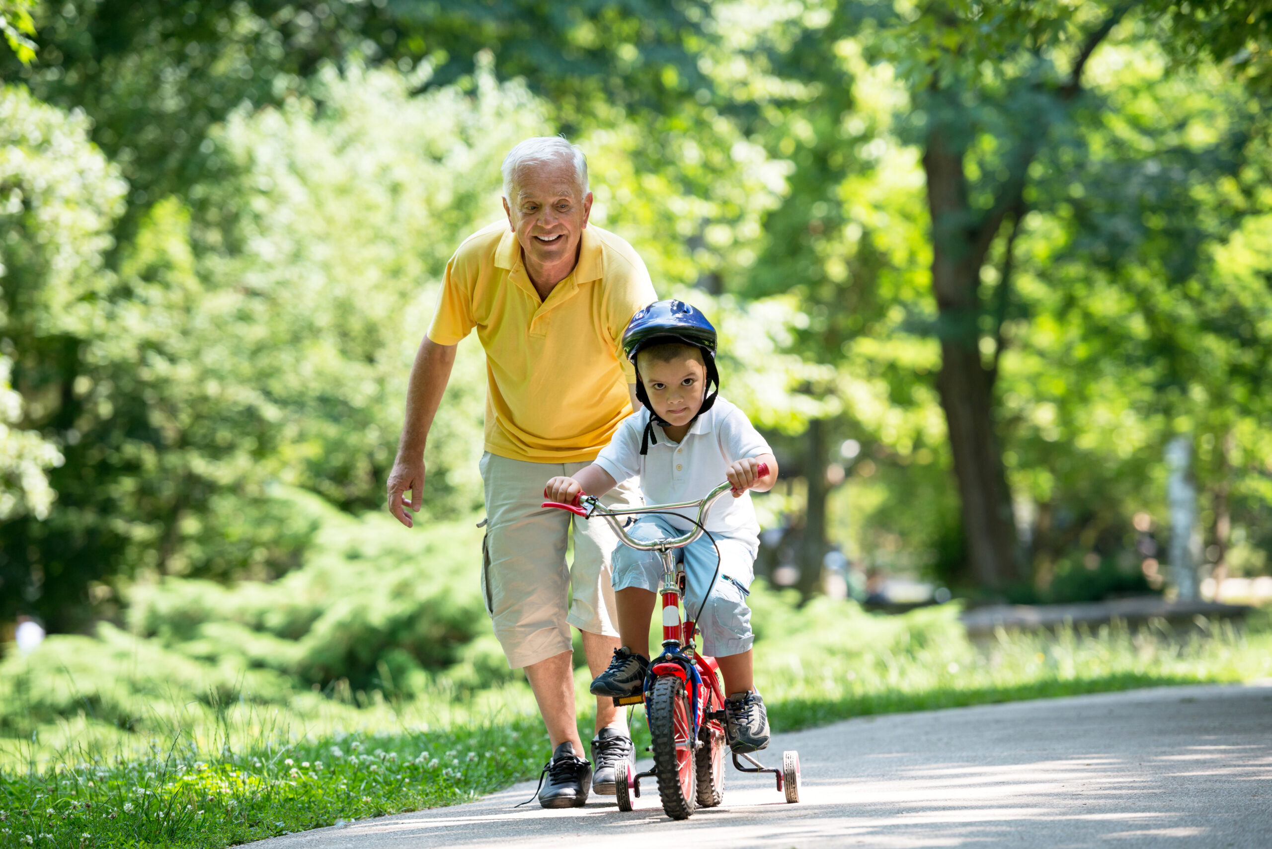 grandfather and child have fun in park